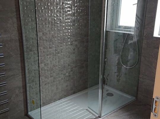 A renovated bathroom shower