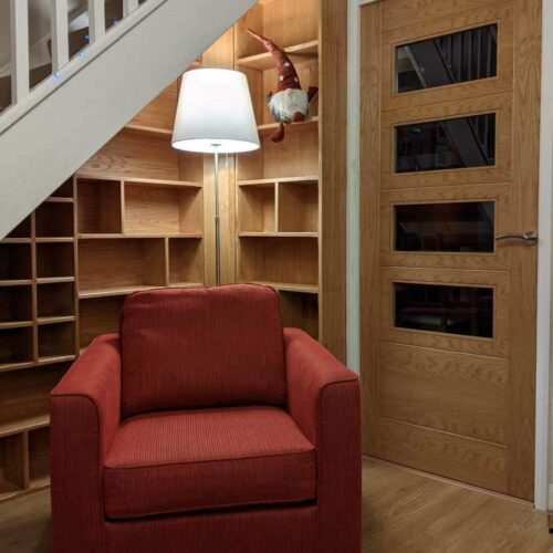 A red armchair in a newly renovated living space