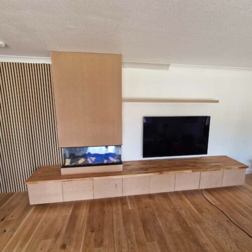 A TV wall unit and cupboard